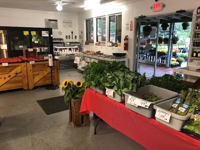 Leafy greens, asparagus and sunflowers inside the store