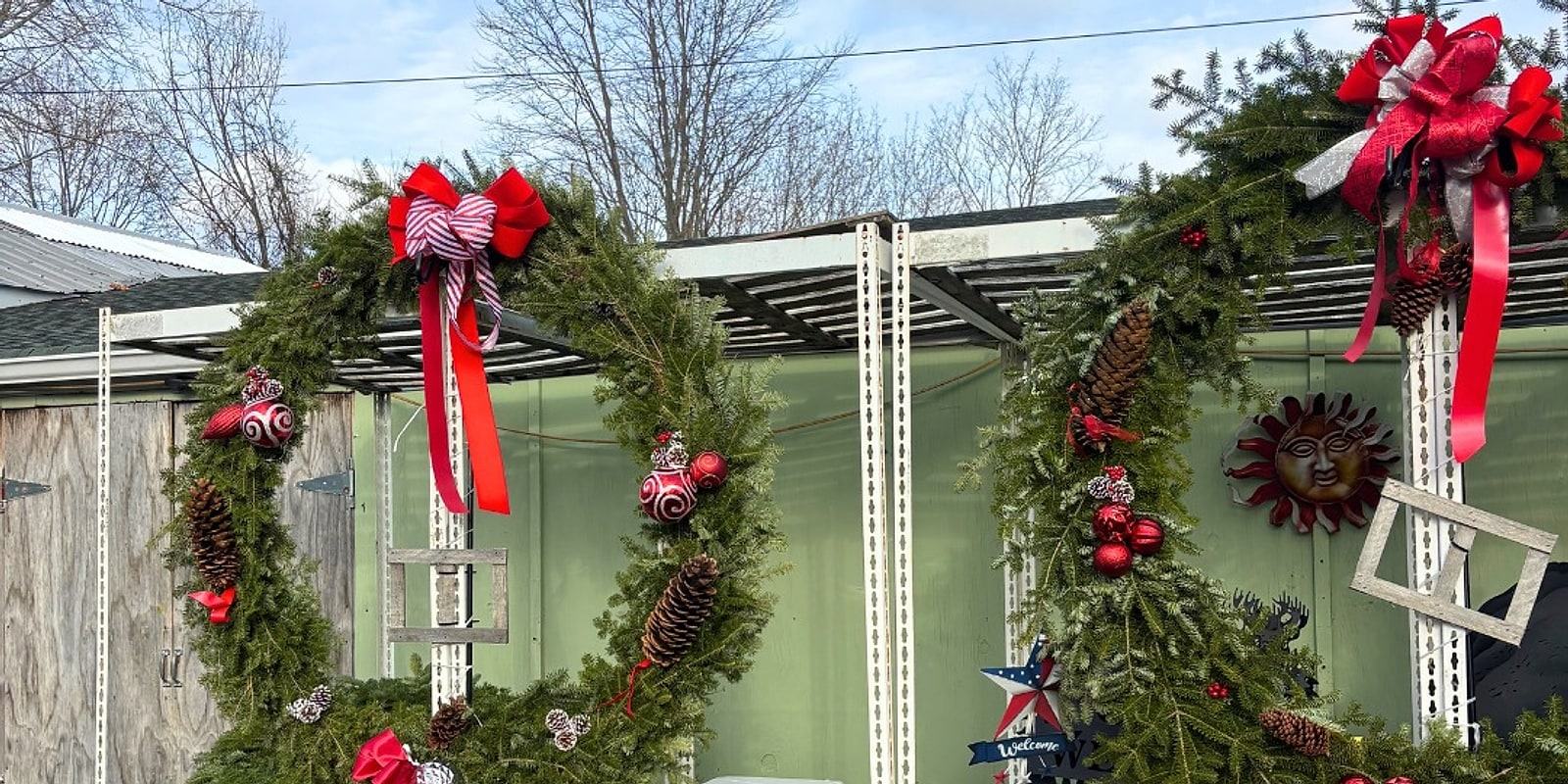 Big evergreen wreaths with red bows