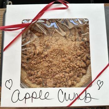 An apple crumb pie in a gift box