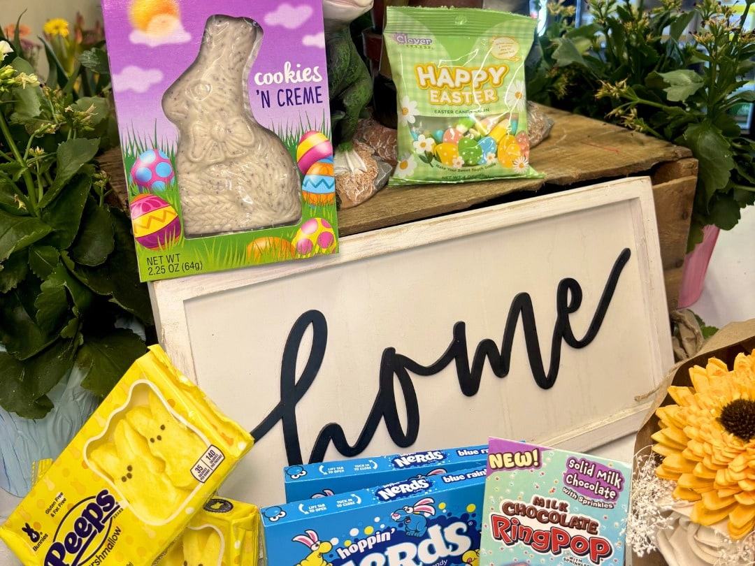 Easter candy next to a wooden home sign