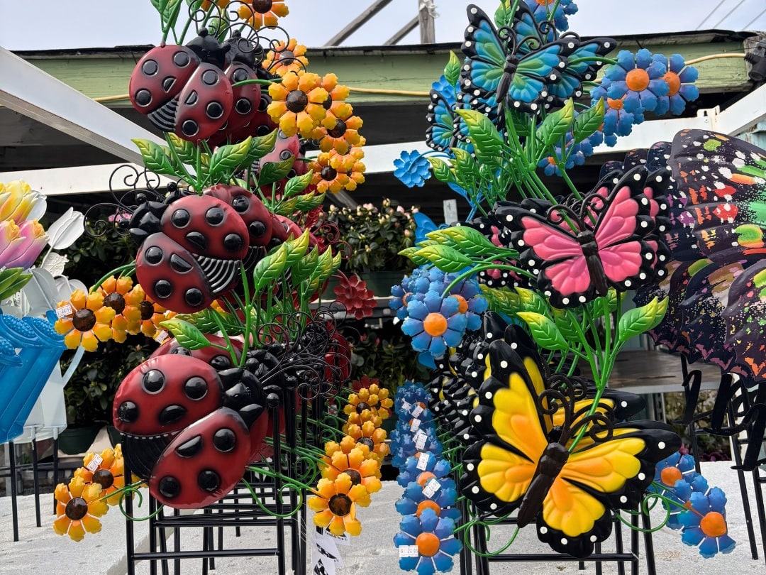 Colorful metal ladybug and butterfly garden stakes