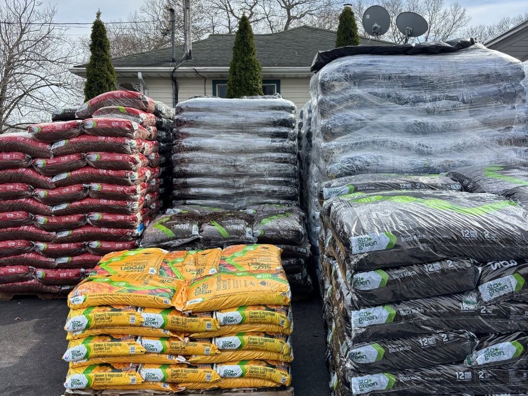 Pallets of bagged soil and mulch