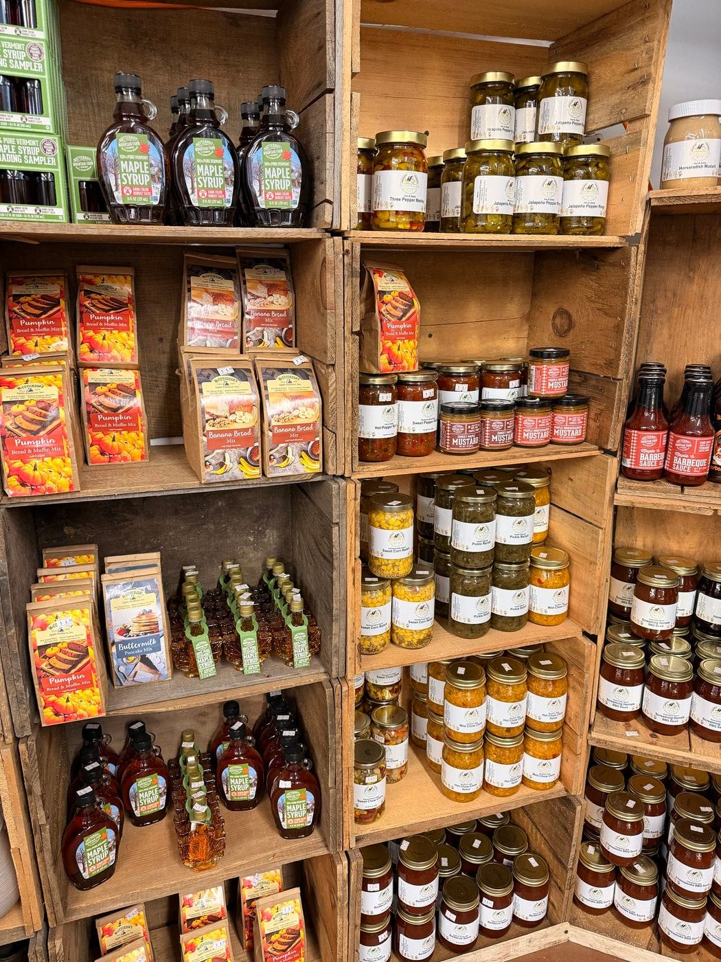 Shelves of local honey, jams, pickles and maple syrup
